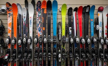 Rack of rental skis and snowboards